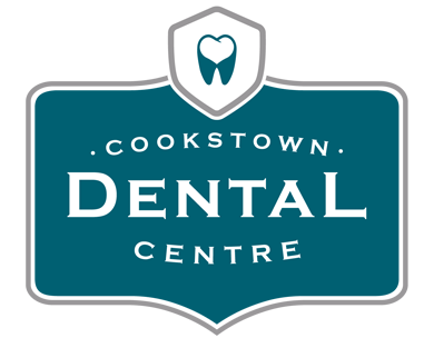 A blue and white logo for the dental centre.